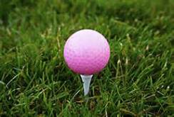 pink golf ball on tee